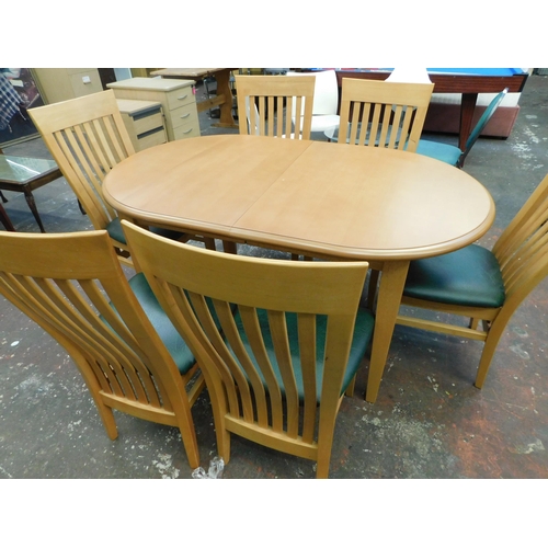 247 - Beech coloured extending dining table and six chairs