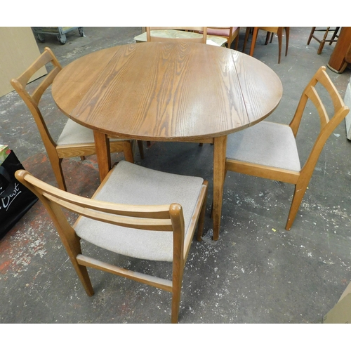 298 - Circular folding wooden table and four chairs - approx. 42