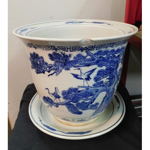 341 - Large blue and white print planter with base plate - approx. 13