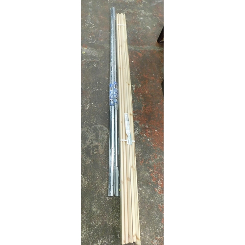 5 - Bundle of 2.1m pine architrave and two heavy duty metal door seals