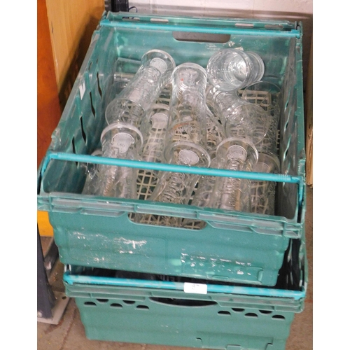 67 - Two trays of pint glasses (some advertising) and drip trays