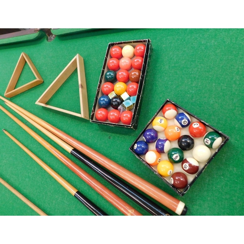 281 - Ambassador 6' x 3' snooker/pool table - incl. four cues, rest, two triangles and boxes of snooker & ... 