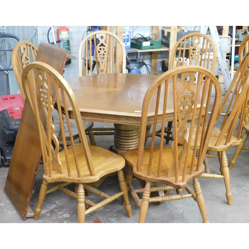 56 - Large octagonal extending table and six chairs