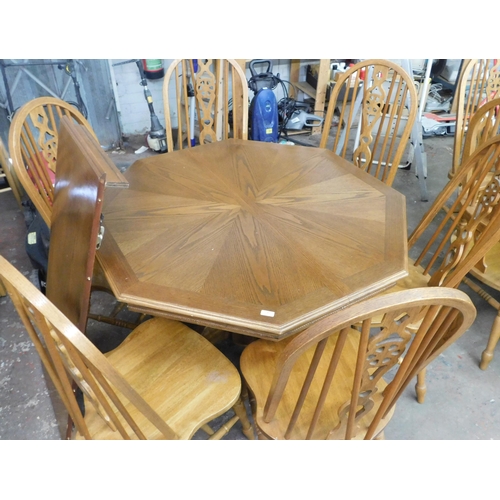 56 - Large octagonal extending table and six chairs