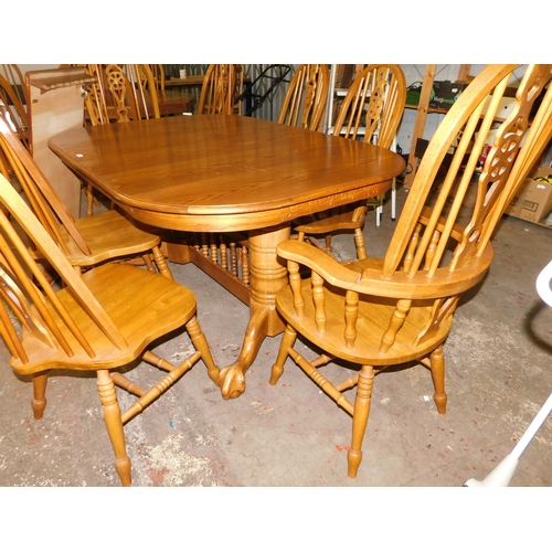 296 - Large extending table and eight chairs (6x dining 2x carver inc 2x extra leaves)