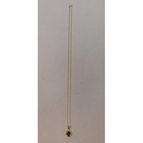 423 - 9ct Gold chain with 9ct garnet pendant - weight 1.75g