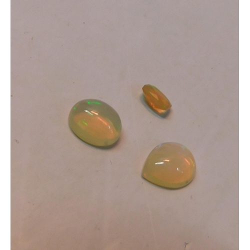 401 - Three genuine pearlescent opal stones (originally shanked in rings) - 3.25ct