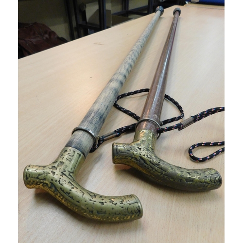 464 - Two brass topped walking sticks