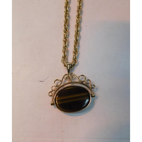 504 - 9ct Gold chain with 9ct gold tigers eye and black onyx fob- weight 15.62g