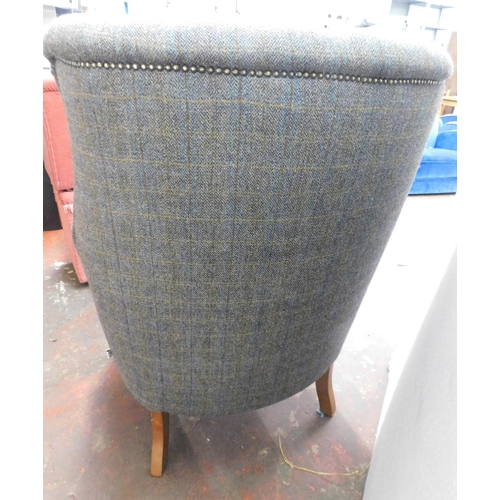 104 - Harris Tweed button backed fireside armchair