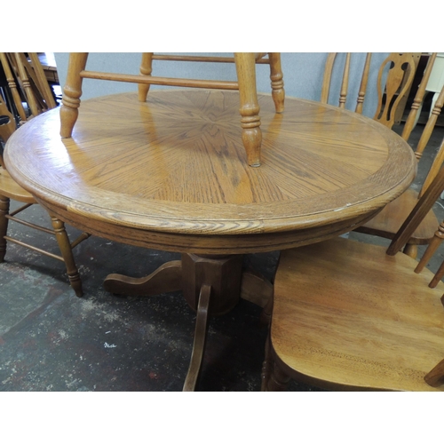 192 - Circular oak table and four chairs - approx. 42