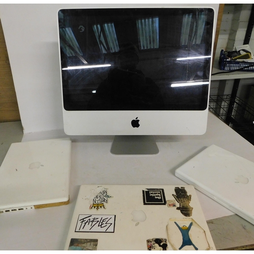 76 - iMac and three white Macbooks - unchecked