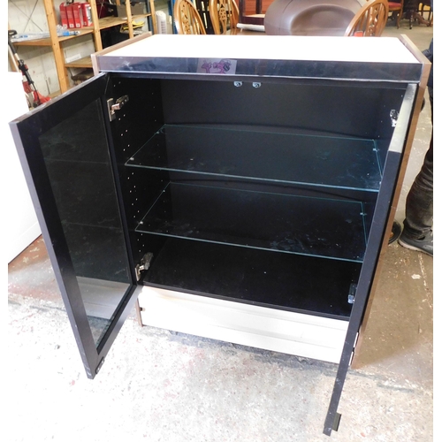 182 - Glass fronted cabinet with glass shelves and built in lights