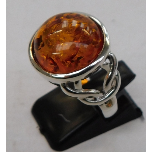 375 - Silver and amber Celtic ring