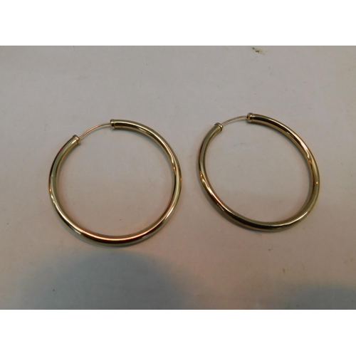 486 - 9ct Gold large hoop earrings - weight 1.87g