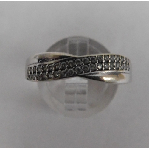 379 - 9ct White gold crossover ring - size S, weight 1.39g