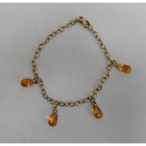 462 - 9ct Gold bracelet with four citrine teardrops - weight 6.99g