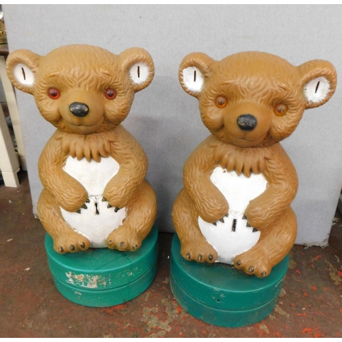 100 - Two large plastic money collecting bears (outside shops etc)