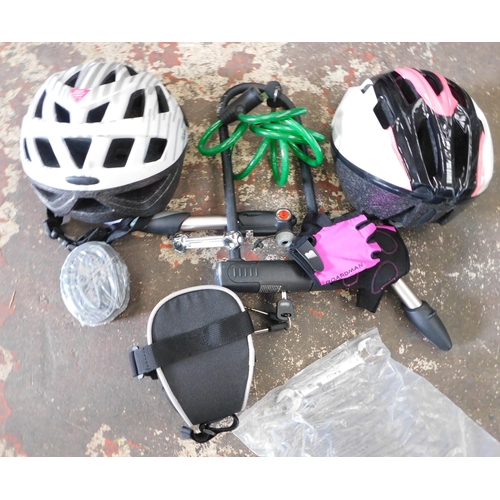 106 - Two bike helmets - as new - (for display purposes), bike gloves, two pumps and tools etc.