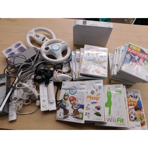 122 - Wii console, 20x games and accessories (unchecked)