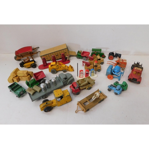 Selection of vintage miniature farm vehicles and accessories