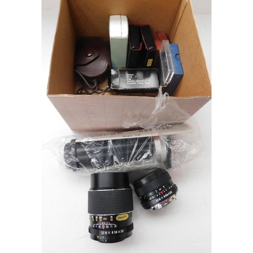 Box of two lenses and accessories
