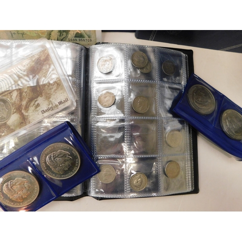 Box of coins, bank notes and empty folders