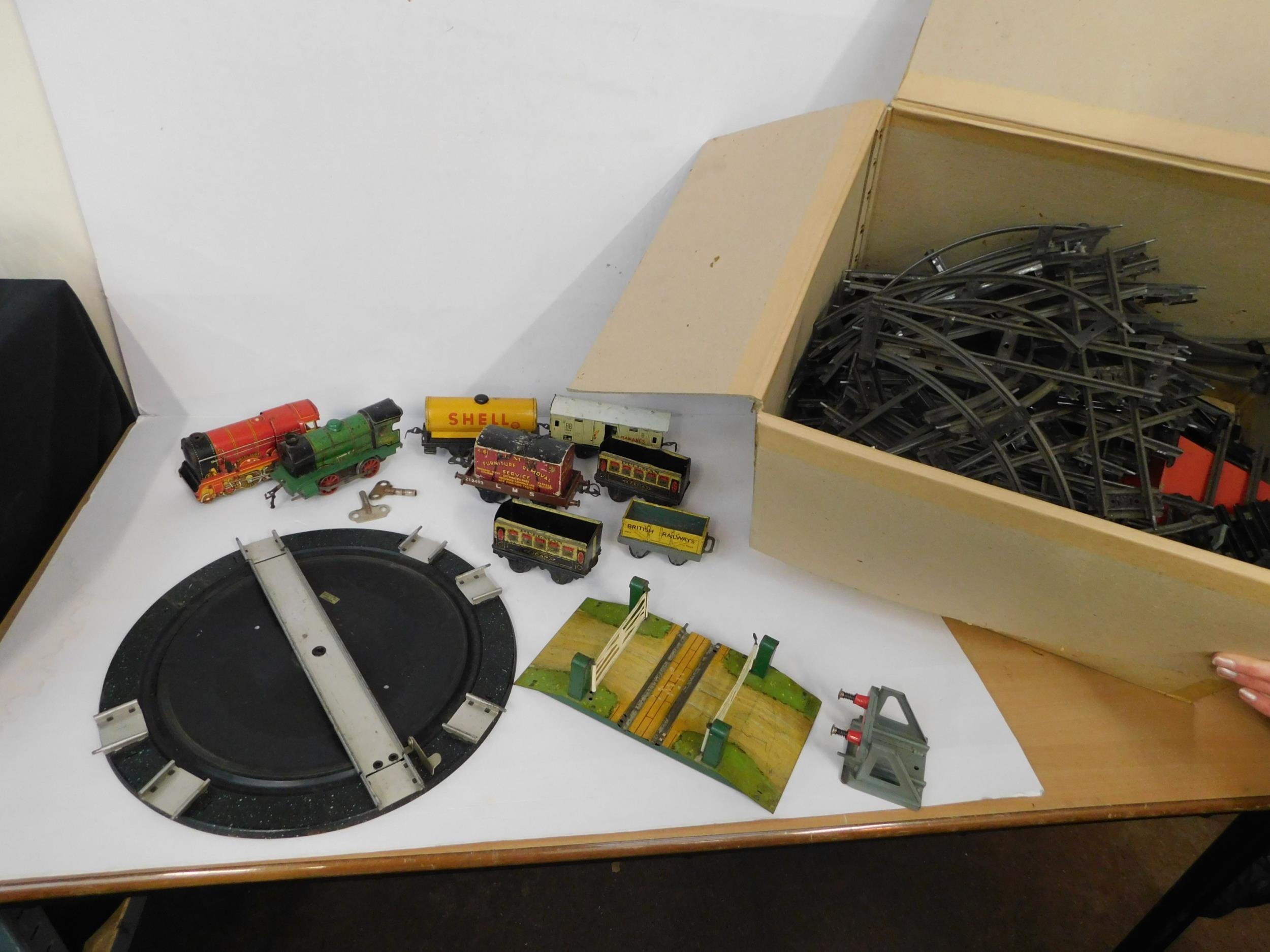 Clockwork 'O' gauge engines, tender/carriages, track etc.