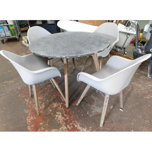 52 - Round garden table (table top very heavy) and four chairs - approx. 43