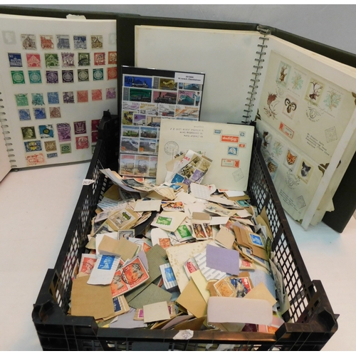 253 - Three stamp albums, loose stamps and FDCs