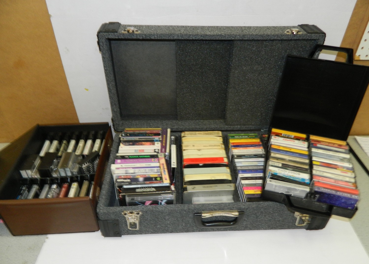 Three boxes of cassettes, 8 tracks and CDs