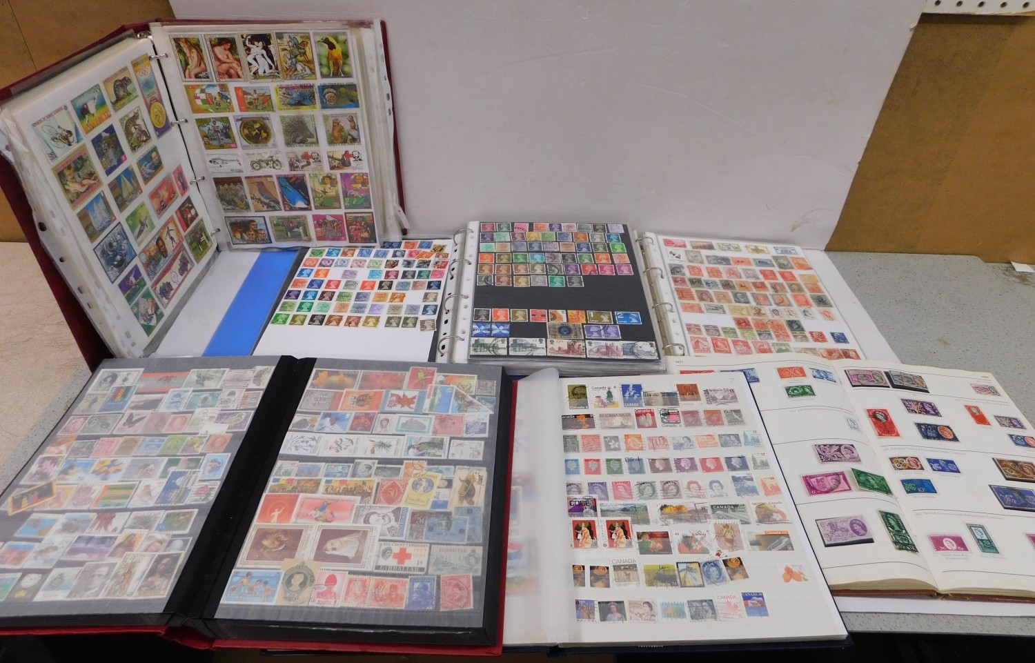 Six well filled stamp albums of World stamps