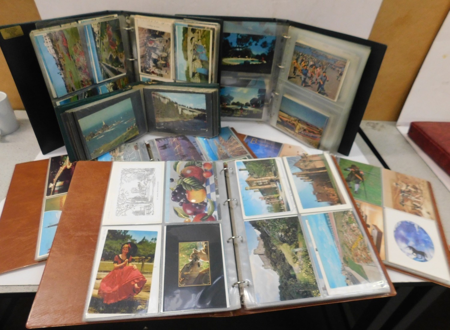 Six well filled postcard albums - mainly vintage