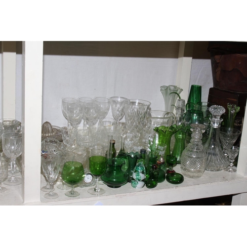 101 - Collection of clear and green glassware including vases, decanters, bowls, etc.