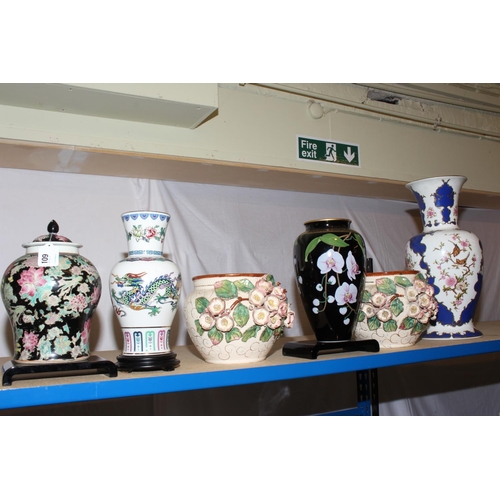 109 - Pair of floral encrusted jardinieres, bird and floral decorated blue and white vase, Chinese temple ... 