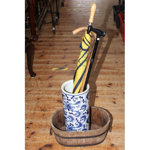 129 - Oriental blue and white stick stand, brolly and two sticks together with a coopered oval planter.