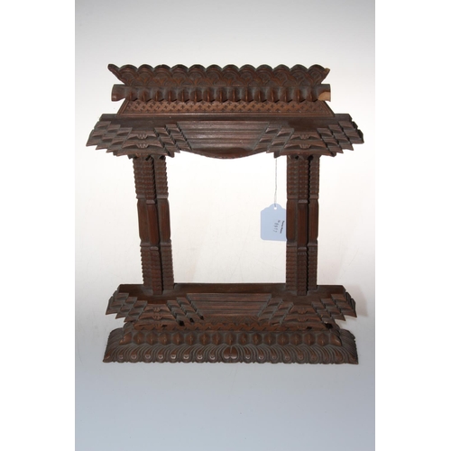 221 - Eastern wood photograph frame, overall 34cm by 29cm. Condition: Damage to pediment.