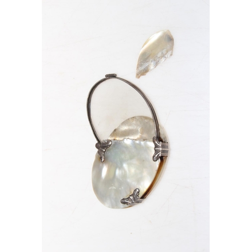 302 - Mother of pearl and silver mounted magnifier, 8cm across.