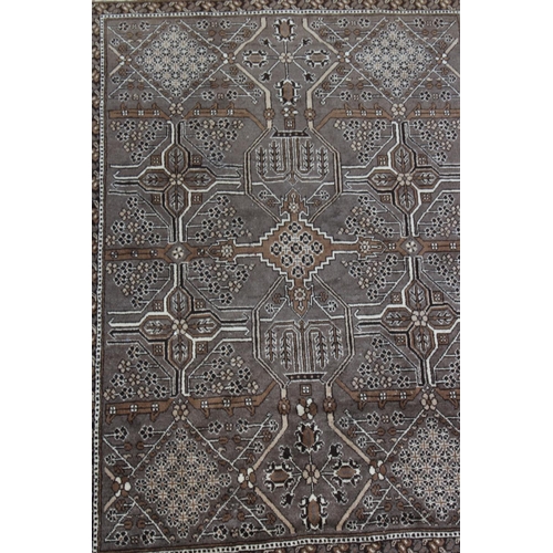 382 - Persian design wool carpet with a brown ground, 3.10 by 2.05.