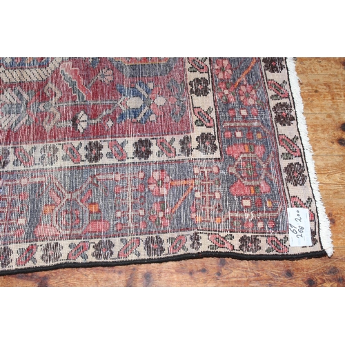 383 - Hand knotted Iranian wool carpet with a red ground, 2.66 by 2.00.