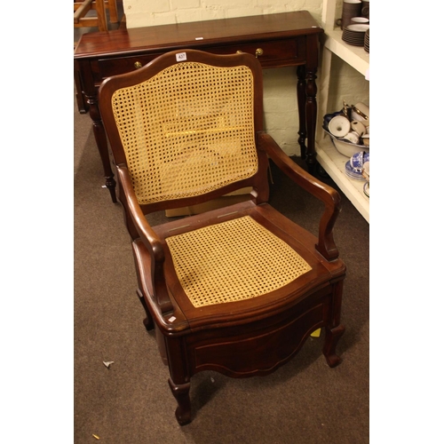 437 - Mahogany framed bergere panel back and seated commode armchair.