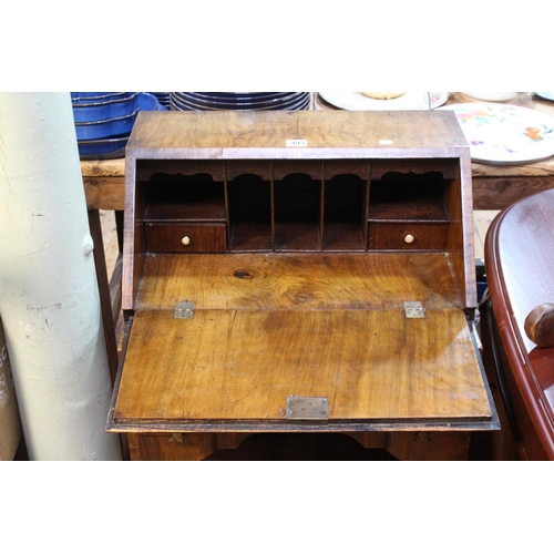 443 - Neat walnut inverted serpentine front two drawer bureau on ball and claw legs, 91cm by 51cm by 37cm.