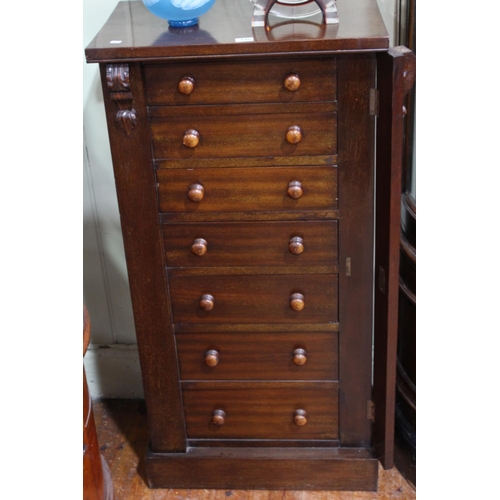 446 - Mahogany Wellington chest with seven graduated drawers with turned knob handles, 53.5cm wide, 106.5c... 