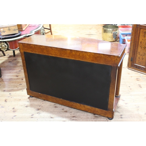 472 - Empire style bow front console in burr veneered with metal mounts, the top with columns to undershel... 