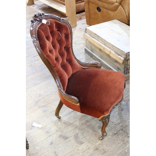 476 - Victorian carved walnut nursing chair in button draylon.