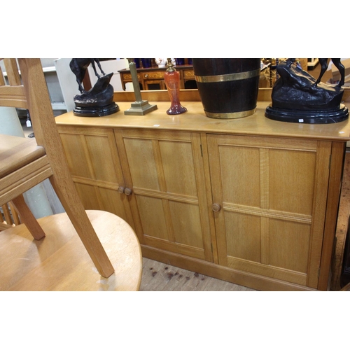 482 - Golden oak ten piece dining suite comprising triple panel door sideboard, oval dining table and eigh... 