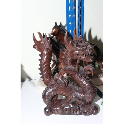 88 - Carved wood dragon and two other dragon ornaments, horse and other animal ornaments, china posies, t... 