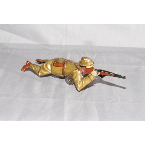 11 - Pre War Einfalt tinplate Sniper with crawling and sparking rifle.   Minor wear.   Excellent clockwor... 