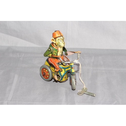 19 - Arnold Germany US Zone clockwork tinplate Monkey on Tricycle.   Very Good clockwork motor works.