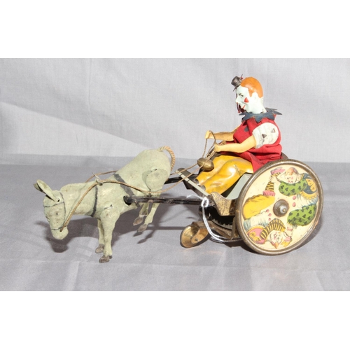 2 - Lehmann Balky Mule clockwork toy.   Original paint and clothing.   Very Good clockwork motor works.